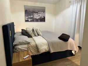 Bedroom with wood finished floors