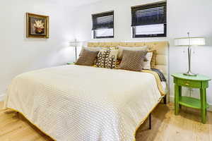 Bedroom featuring light wood-style flooring and baseboards