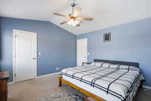 Bedroom with light colored carpet and ceiling fan