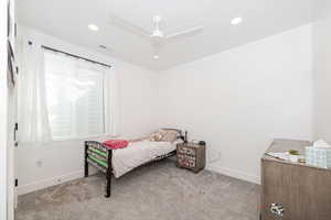 Bedroom with carpet, a ceiling fan, and recessed lighting