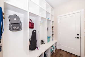 Mudroom with dark wood-style flooring