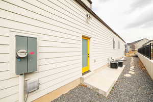 View of side of property featuring a central AC unit