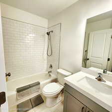Full bathroom featuring vanity and shower / tub combination