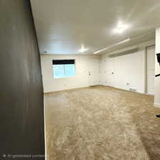 Spare room with a textured ceiling and carpet floors