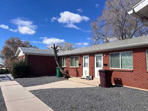 View of front of house with brick siding