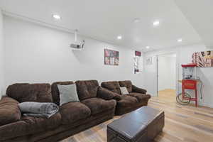 Living room featuring recessed lighting and light wood-style flooring