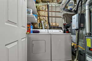 Laundry area with heating unit and independent washer and dryer