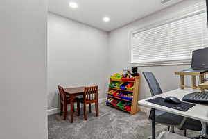 Office area with recessed lighting and light colored carpet