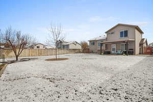 Back of house featuring a patio area, a fenced backyard, and a residential view