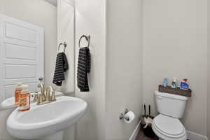 Bathroom with toilet and a sink