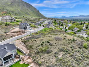 Aerial perspective of suburban area featuring a mountain backdrop