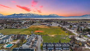 Aerial view of residential area featuring a mountainous background