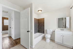 Full bathroom featuring vanity, tub / shower combination, and light tile patterned floors