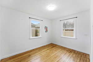 Empty room featuring light wood-style floors and baseboards