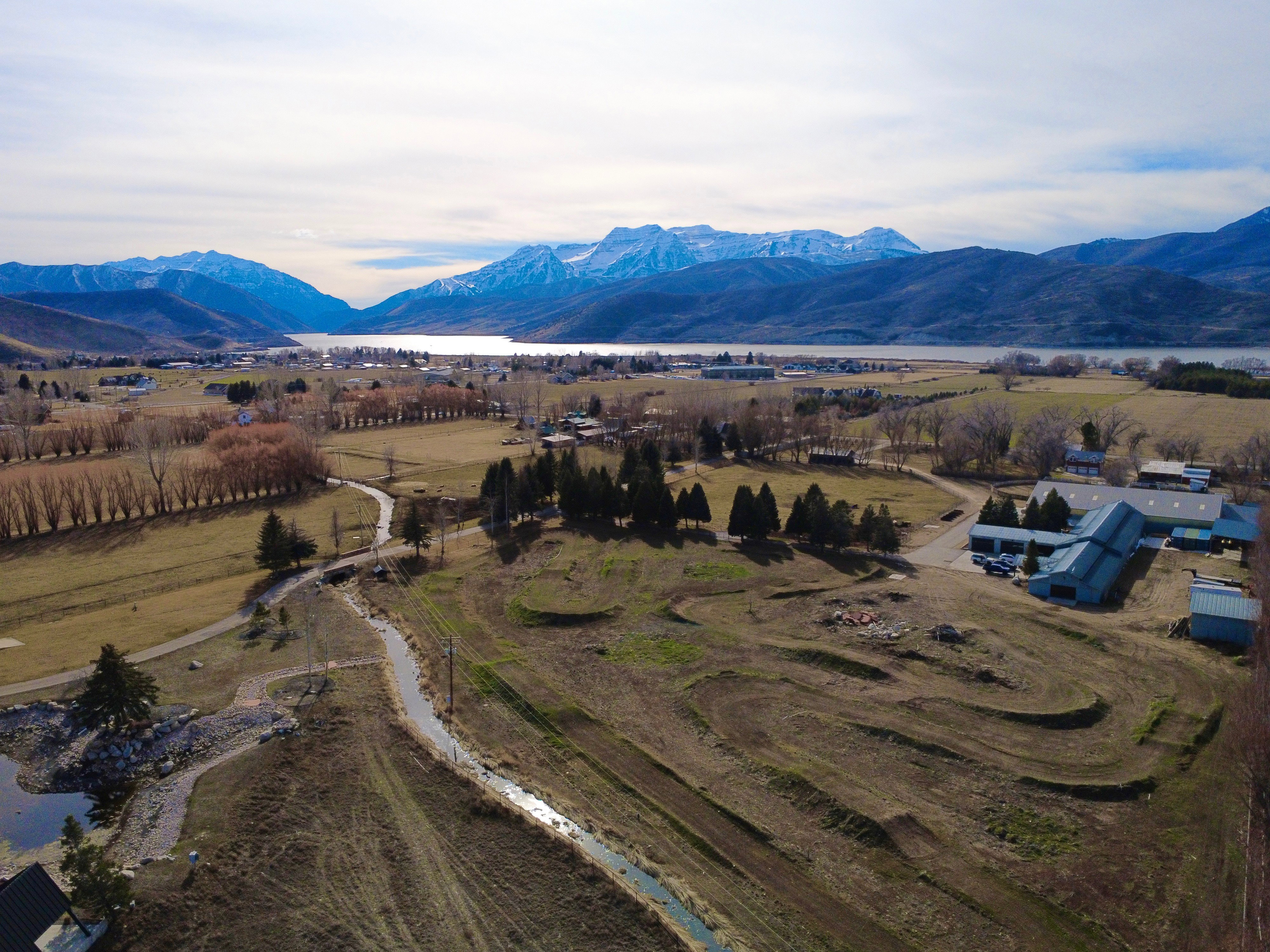 Aerial view of sparsely populated area with a mountain backdrop