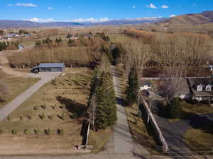 Aerial view of sparsely populated area with a mountain backdrop