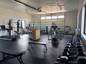 Exercise room featuring a garage