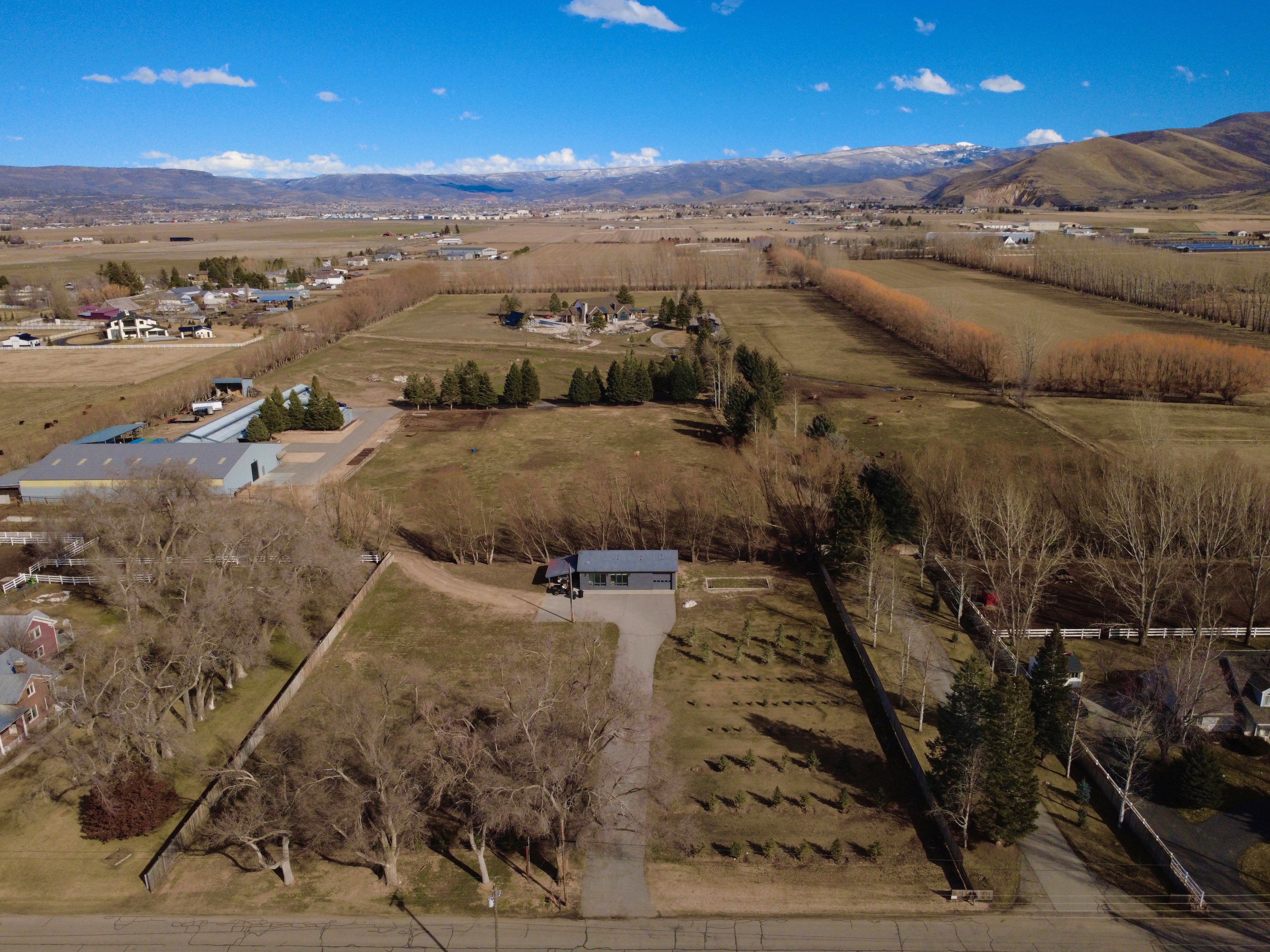 Overview of rural landscape with a mountainous background and extensive farmland