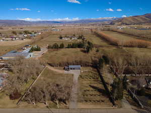 Overview of rural landscape with a mountainous background and extensive farmland