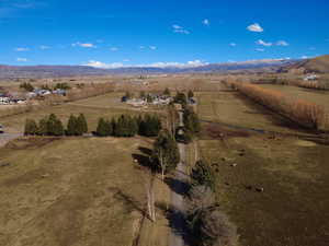 Aerial view of sparsely populated area with mountains and extensive farmland
