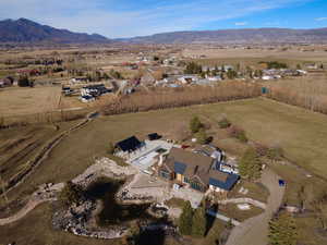 Aerial view of property's location featuring rural landscape and mountains