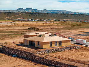 View of subject property with a mountain backdrop