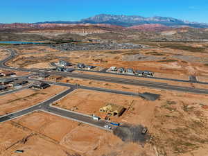 Aerial view of property's location with a mountainous background and rural landscape