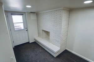 Basement Entry with dark carpet and recessed lighting