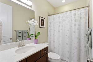 Bathroom featuring vanity and a shower with shower curtain
