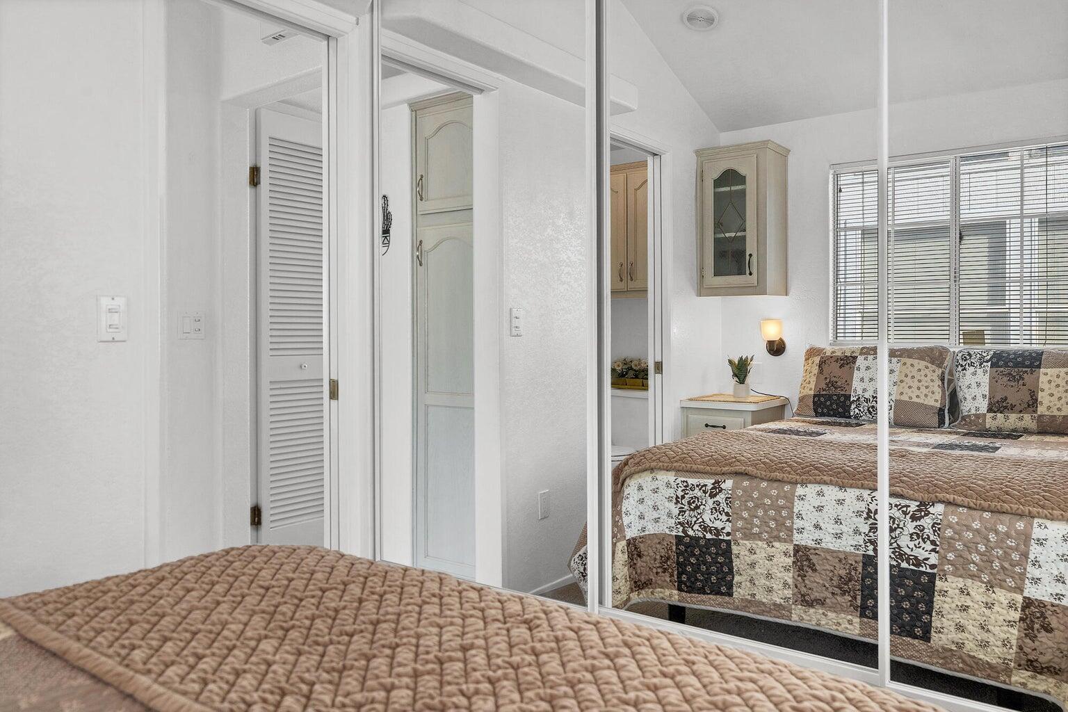 Mirrored closet doors providing visual depth