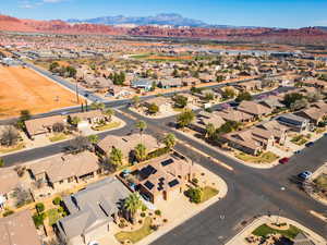 Aerial perspective of suburban area featuring a mountain backdrop