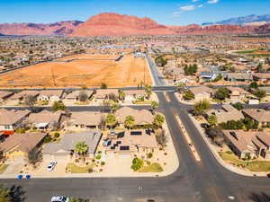 Aerial perspective of suburban area featuring a mountain backdrop