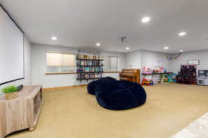 Playroom with light colored carpet and recessed lighting