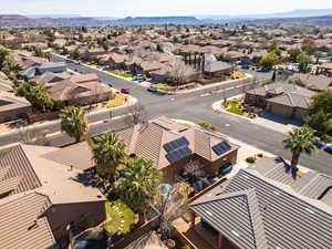 Aerial view of residential area featuring a mountain backdrop