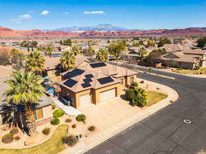 Aerial perspective of suburban area featuring a mountainous background