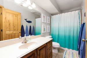 Bathroom featuring vanity and light tile patterned floors