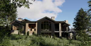 Rear view of property featuring a chimney, board and batten siding, and a balcony