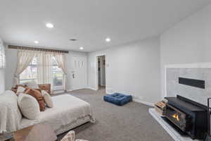Bedroom featuring recessed lighting and light carpet
