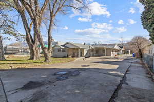 Ranch-style house featuring concrete driveway