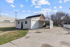Garage featuring a garage and concrete driveway