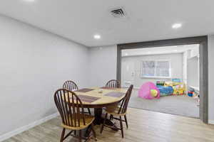 Dining room with light wood-style floors