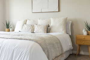 Bedroom featuring baseboards and carpet