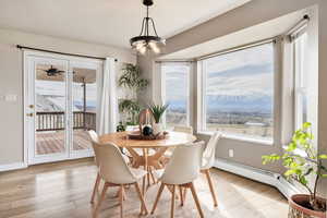 Dining room with a baseboard radiator and light wood-style floors