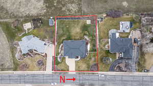 Aerial perspective of suburban area featuring property boundaries highlighted