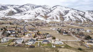 Aerial view of residential area featuring a mountainous background