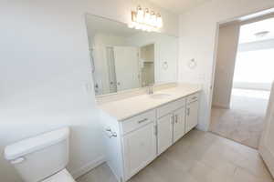 Bathroom featuring vanity and light tile patterned floors