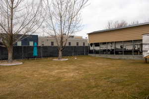 View of yard featuring a sunroom