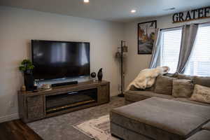 Living room with recessed lighting and baseboards