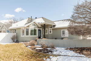 Ranch-style house with stucco siding and a shingled roof