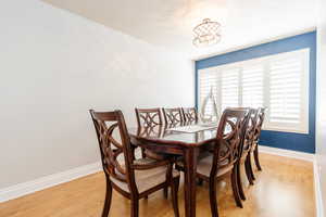 Dining area with light wood-style flooring